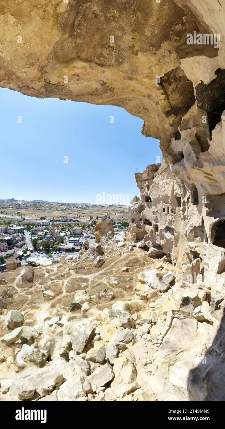 Cavusin village in Cappadocia of Turkey, surrounded by the surreal landscape of fairy chimneys, it offers a glimpse into Cappadocia's rich cultural Stock Photo