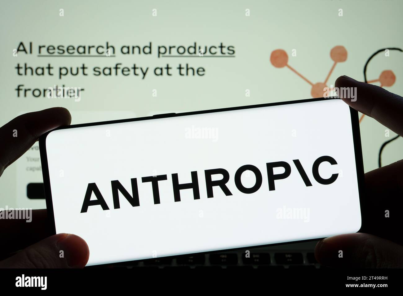 Anthropic AI research company logo seen on the smartphone and blurred company website seen at the background.  Stafford, United Kingdom, October 29, 2 Stock Photo