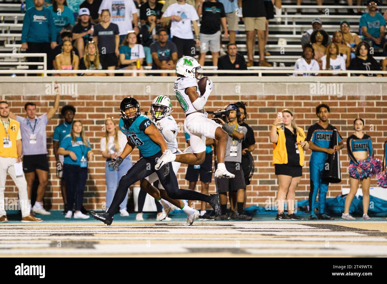 Conway, South Carolina, USA. 28th Oct, 2023. Marshall Thundering Herd safety AG McGhee (18) jumps intercepting a pass intended for Coastal Carolina Chanticleers wide receiver SAM PINCKNEY (Credit Image: © Maxwell Vittorio/ZUMA Press Wire) EDITORIAL USAGE ONLY! Not for Commercial USAGE! Stock Photo