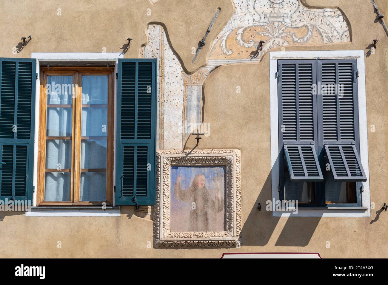 Votive shrine of Saint Leonard of Porto Maurizio on the facade of an old palace in Piazza Garibaldi square, Finalborgo, Finale Ligure, Savona, Liguria Stock Photo