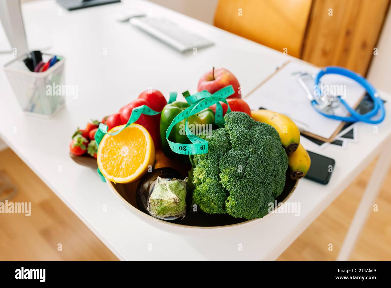 Help Desk Food Medical consultation desk with bowl of healthy food: vegetables and ...