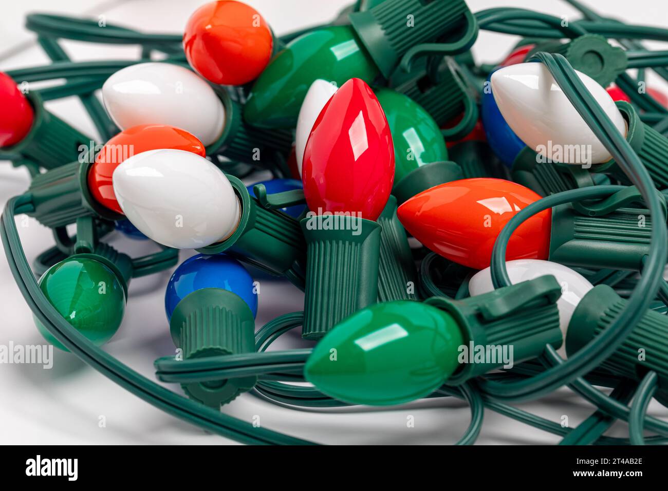 Tangled Christmas string lights isolated on white background. Holiday