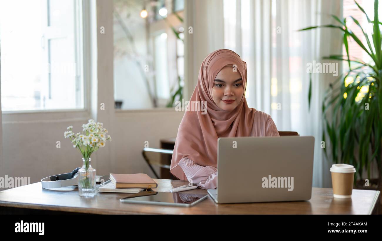 Young woman wearing pink hijab hi-res stock photography and images - Alamy