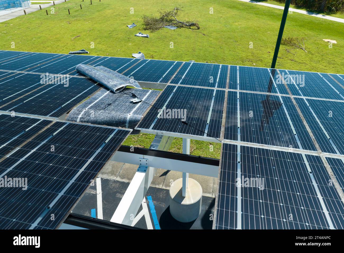 Hurricane wind damage to solar panels installed as shade roof over