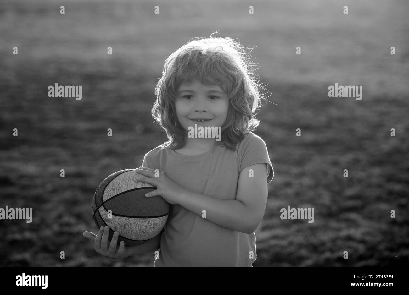 Kid playing basketball. Activity and sport for kids. Stock Photo