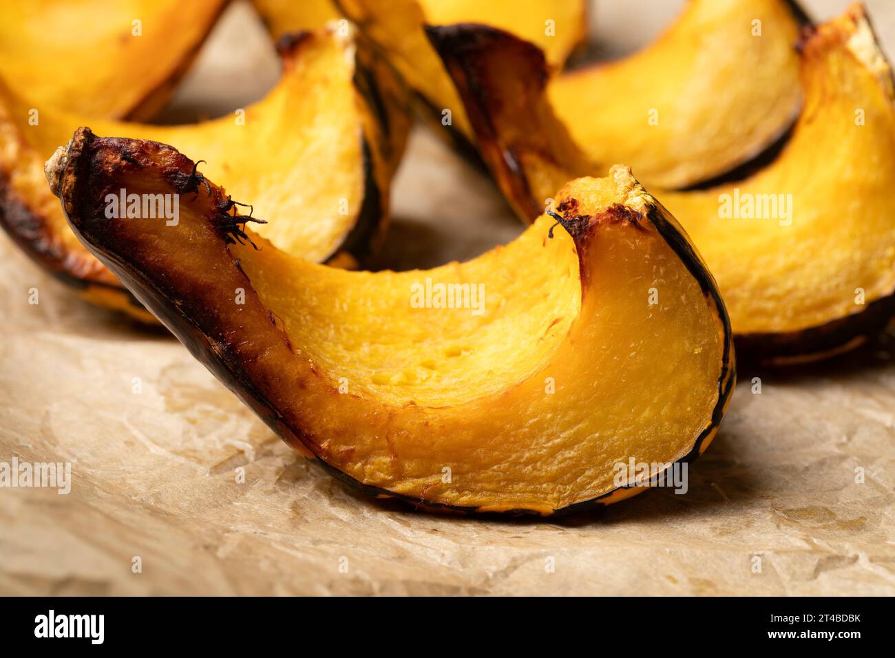 Grilled Acorn Squash wedge straight from the fire close up Stock Photo