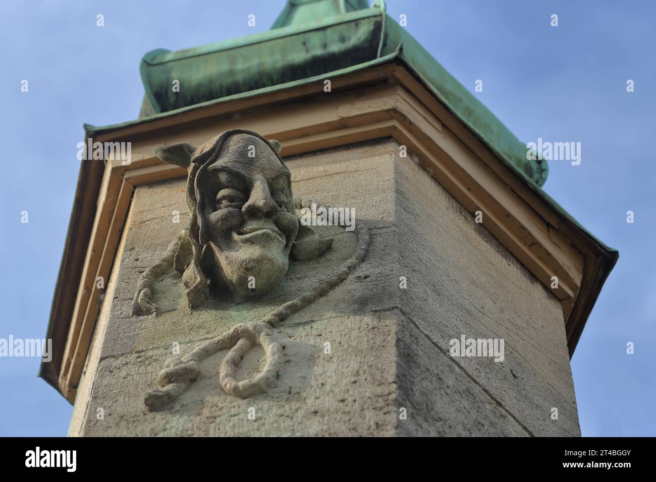 Relief of the executioner figure at the hangman's house, historical, sculpture, devil, face, head, grimace, ugly, grin, rope, noose, horns, stone Stock Photo