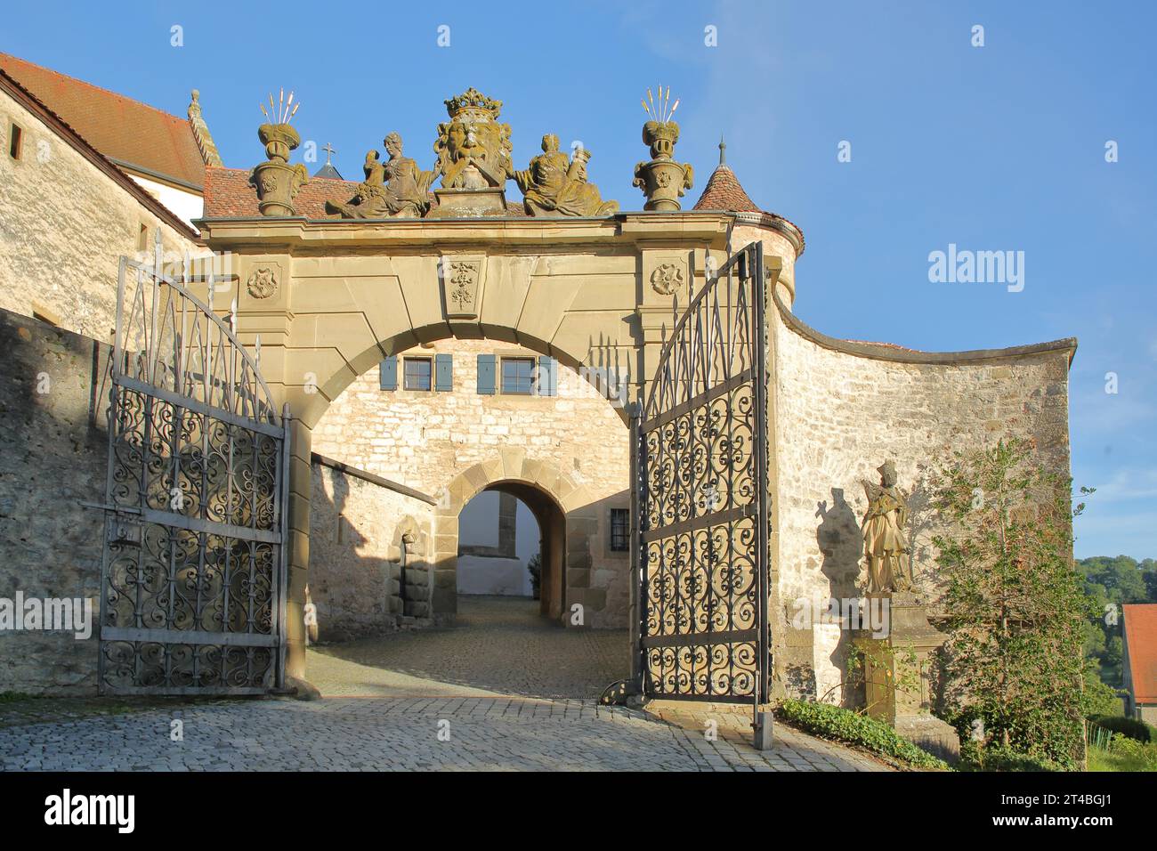 Entrance with archway to the Romanesque Comburg monastery complex ...