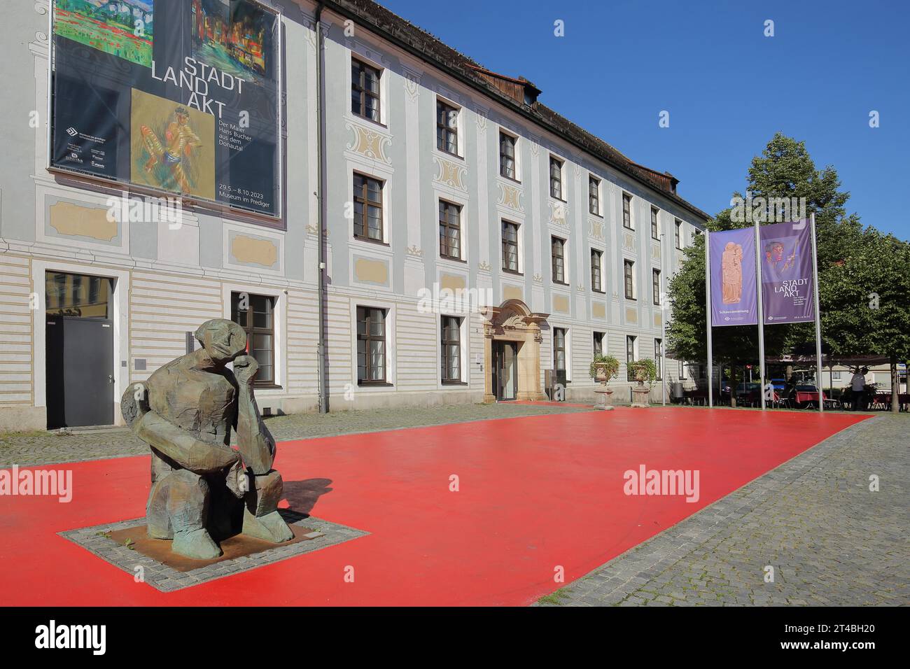 Preacher Museum and former Dominican Monastery and sculpture Nighthart by Dietrich Klinge 2001, flags, banner, inscription, city, country, art, red Stock Photo