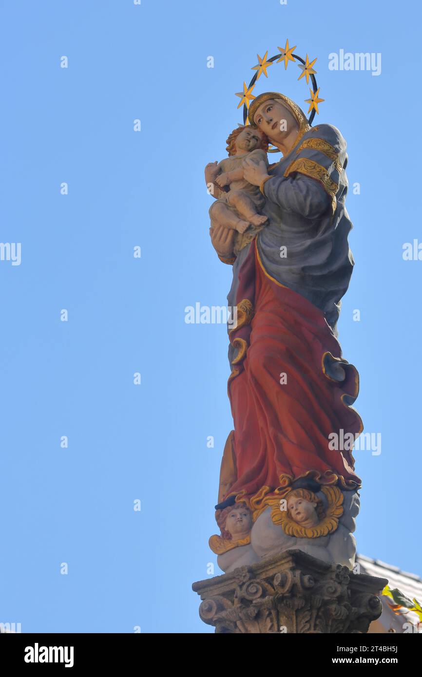 Madonna figure with halo and baby Jesus at the Marian column, free plate, Muensterplatz, Schwaebisch Gmuend, Baden-Wuerttemberg, Germany Stock Photo