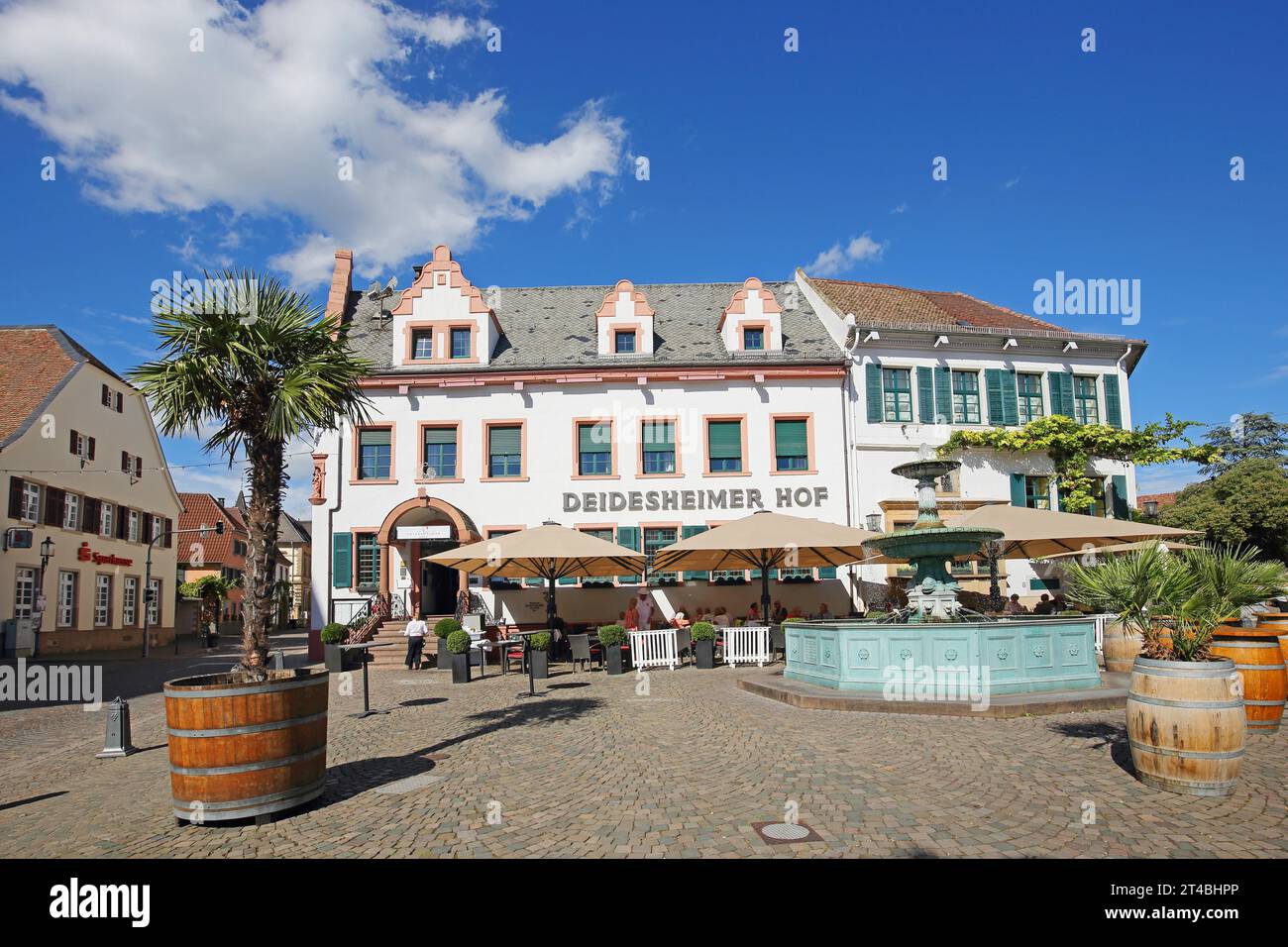 Restaurant Deidesheimer Hof, fountain, building, street pub, palm tree, people, Deidesheim, Rhineland-Palatinate, Germany Stock Photo