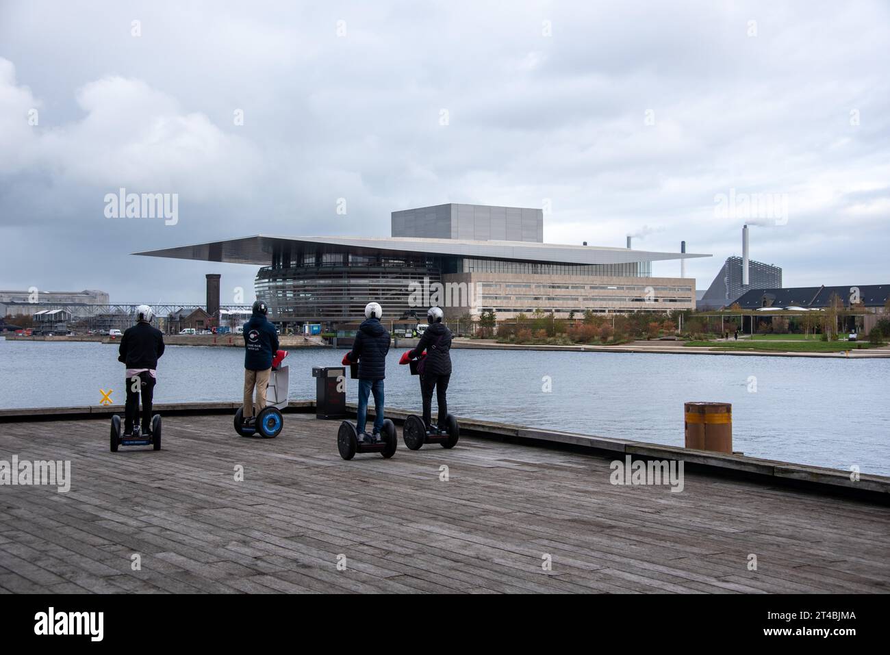 Royal Opera House, also called Operaen, in front of it tourists on Segway, Copenhagen, Denmark Stock Photo