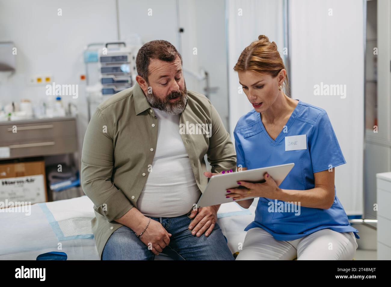 Female doctor consulting with overweight patient, discussing test