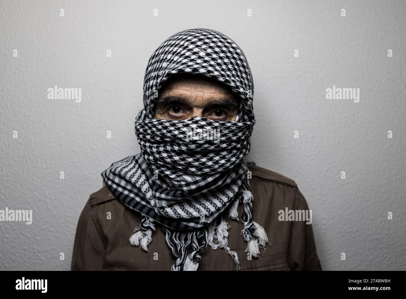 Portrait of military man wearing Palestinian headscarf or shemagh ...
