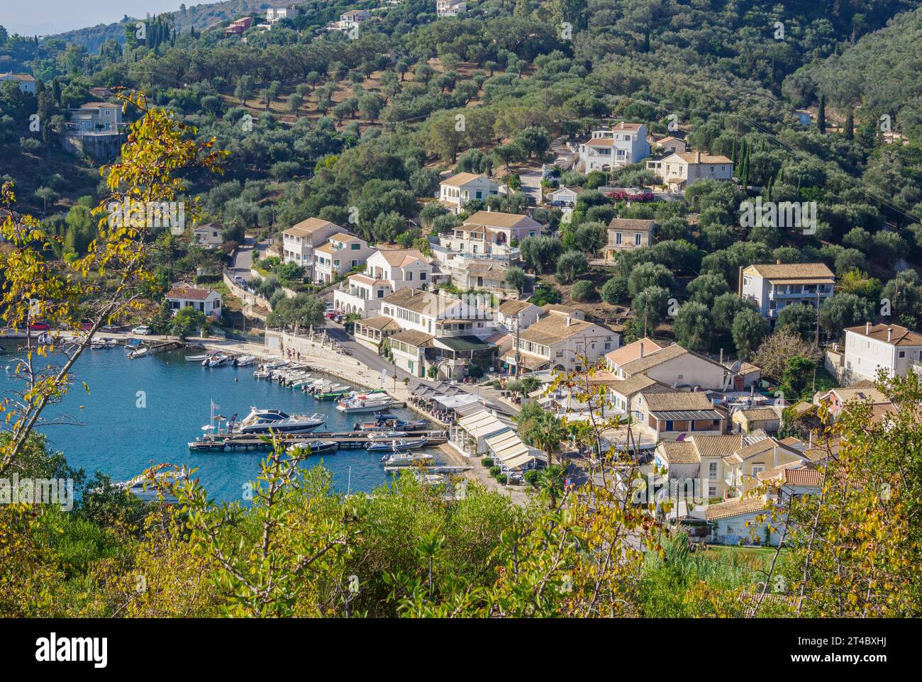 Looking down on the little fishing village of Agio Stefanos on the north-east coast of Corfu in the Ionian Islands of Greece Stock Photo