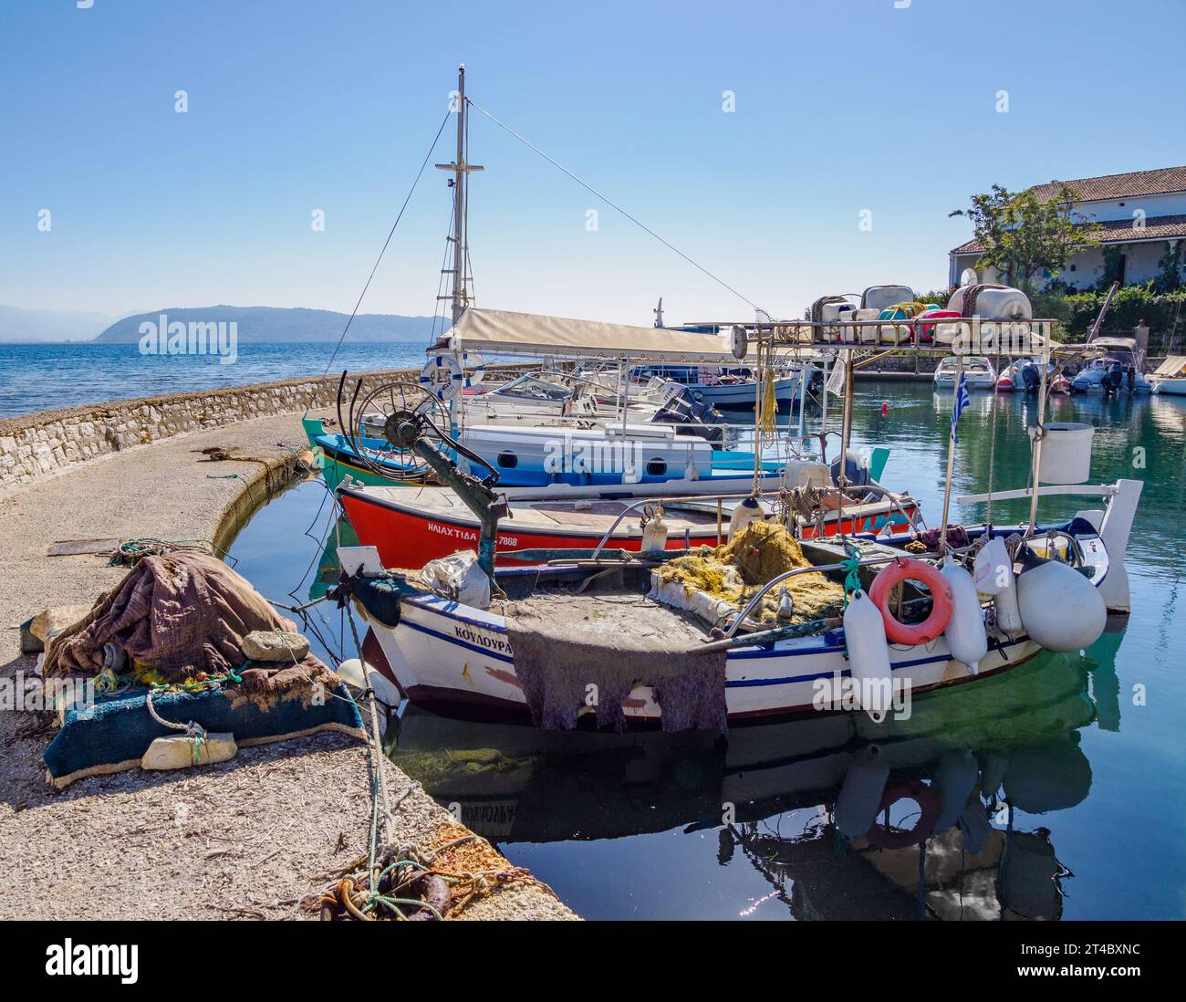 The pretty little fishing harbour of Kouloura on the north-east coast of Corfu in the Ionian Islands of Greece Stock Photo