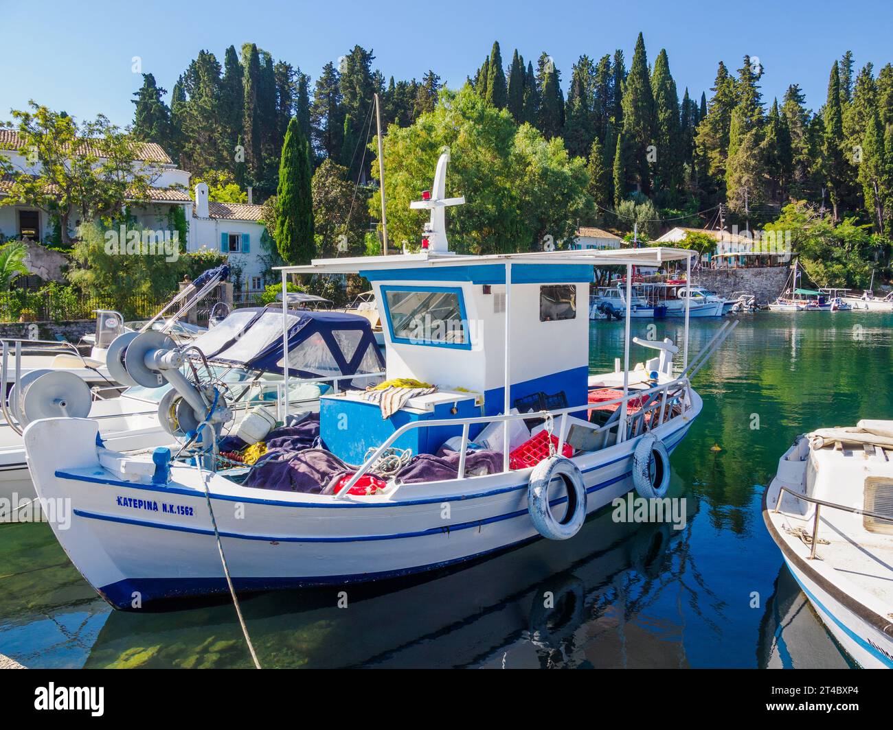 The pretty little fishing harbour of Kouloura on the north-east coast of Corfu in the Ionian Islands of Greece Stock Photo