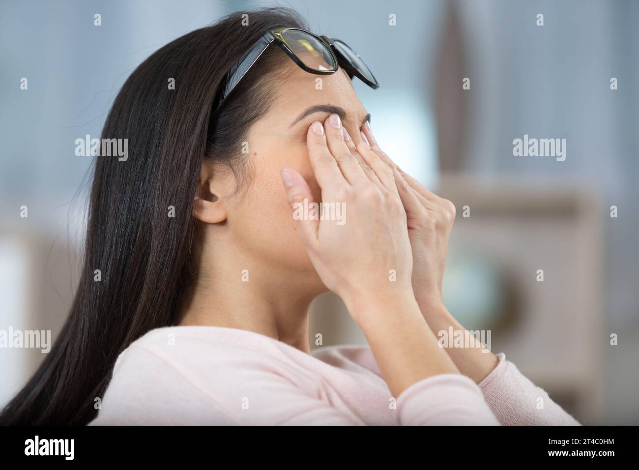 a middle aged woman looking exhausted Stock Photo - Alamy