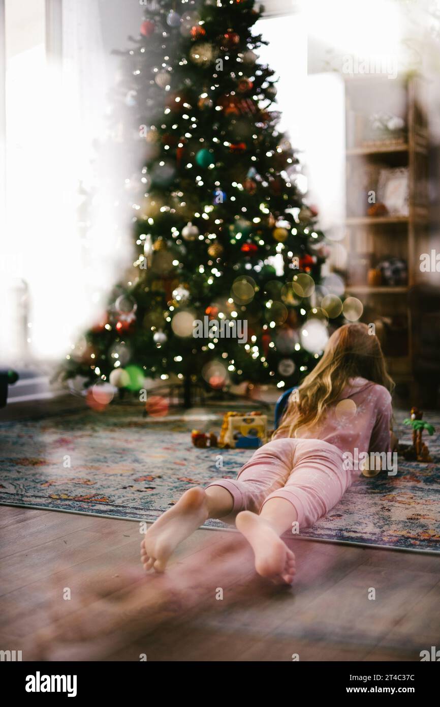 Beautiful woman in striped pyjamas on a Christmas Day Stock Photo - Alamy