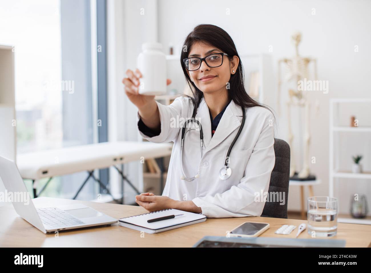 Indian female doctor writing prescription hi-res stock photography and ...