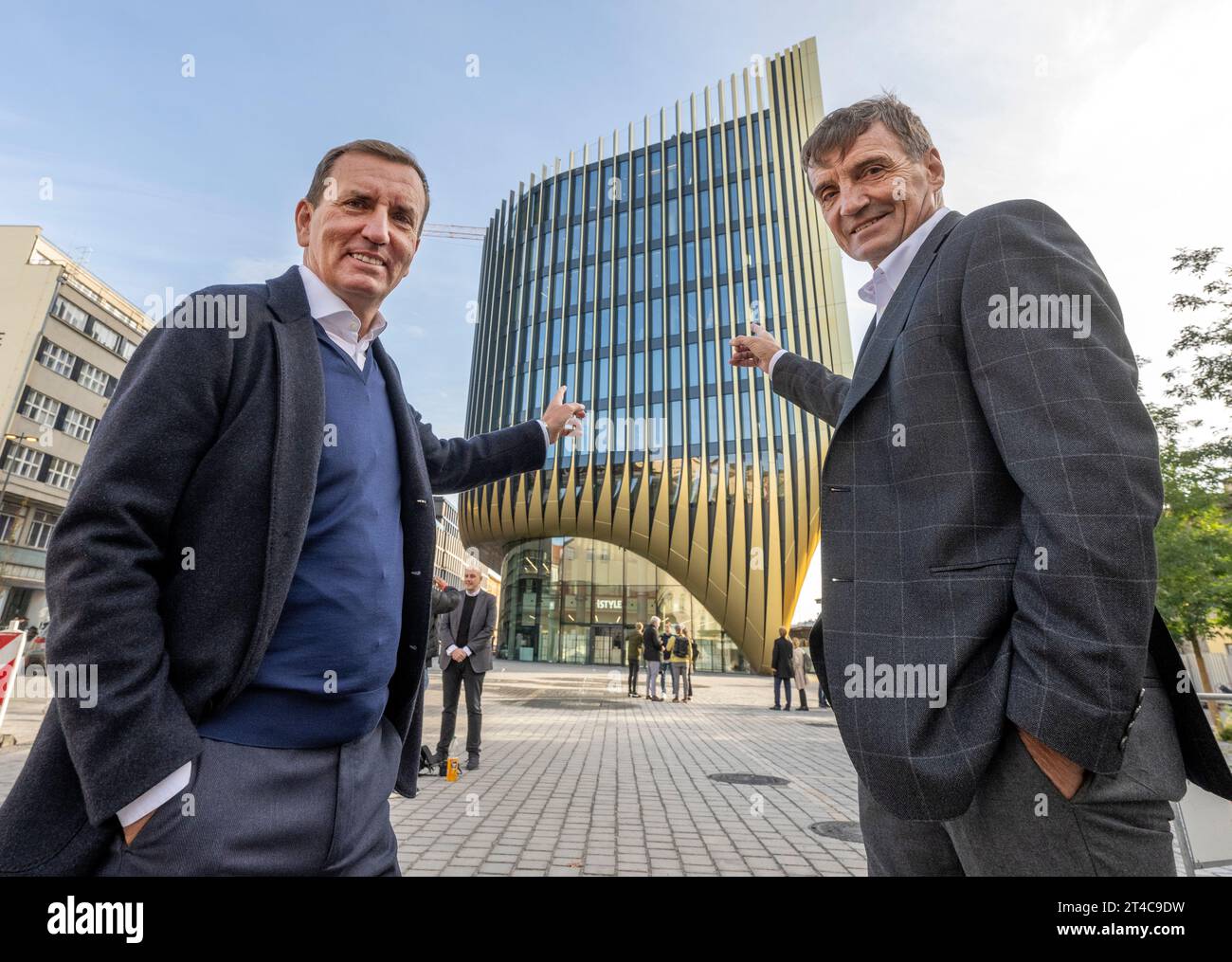 Prague, Czech Republic. 30th Oct, 2023. Co-owner of Penta Marek Dospiva, left, and Penta's Managing Director for the Czech Republic Petr Palicka attend a happening on the occasion of the completion of the golden facade on the western facade of the newmultifunctional building with commercial premises Masarycka pictured on October 30, 2023, in Na Florenci Street near Masaryk Railway Station in Prague, Czech Republic. The architectural design of the building was created by Zaha Hadid Architects. Credit: Michaela Rihova/CTK Photo/Alamy Live News Stock Photo