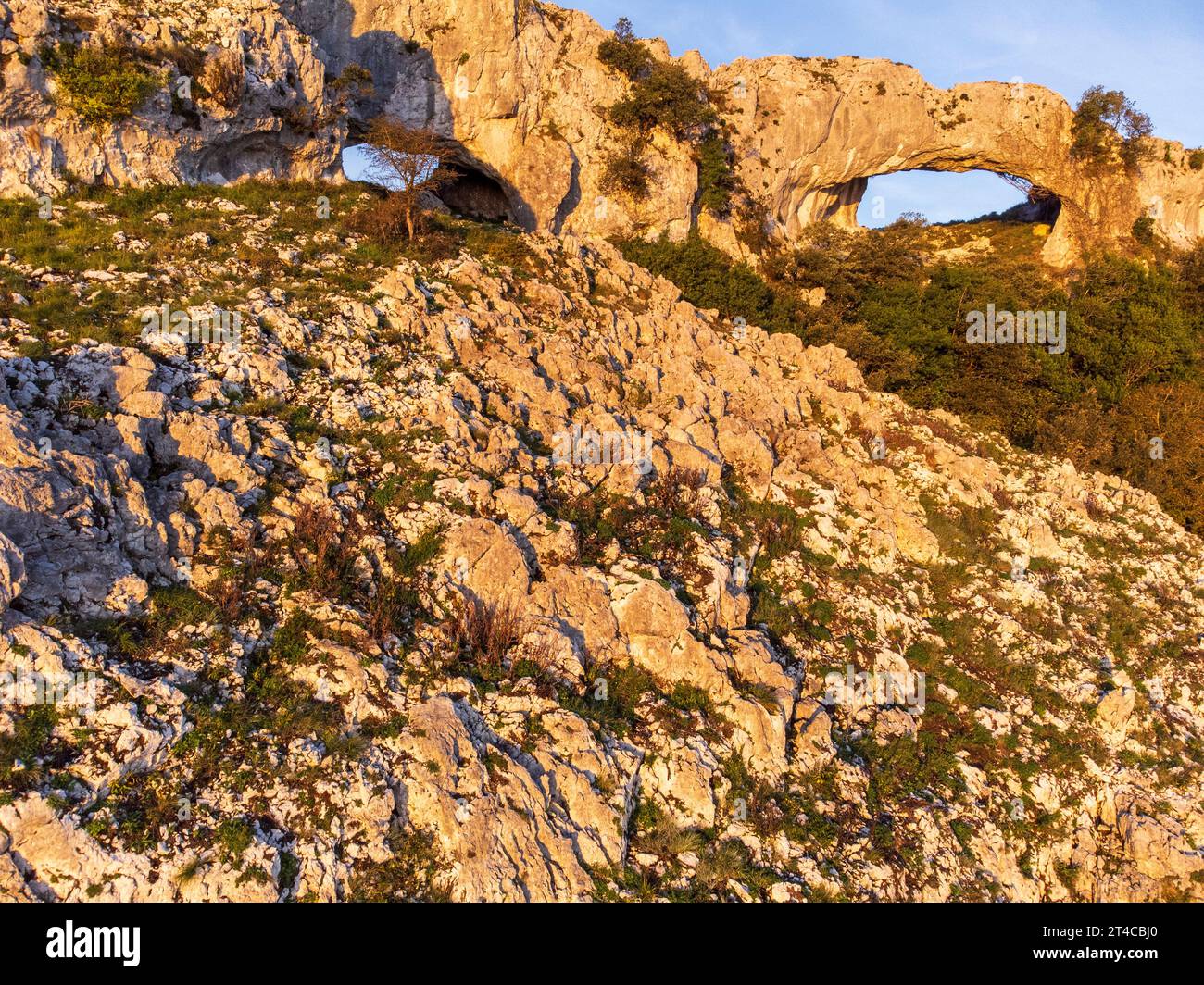 ascent to Llanero arches (eyes of the devil), Pico Candina, Sonabia, Castro Urdiales, Cantabria, Spain Stock Photo