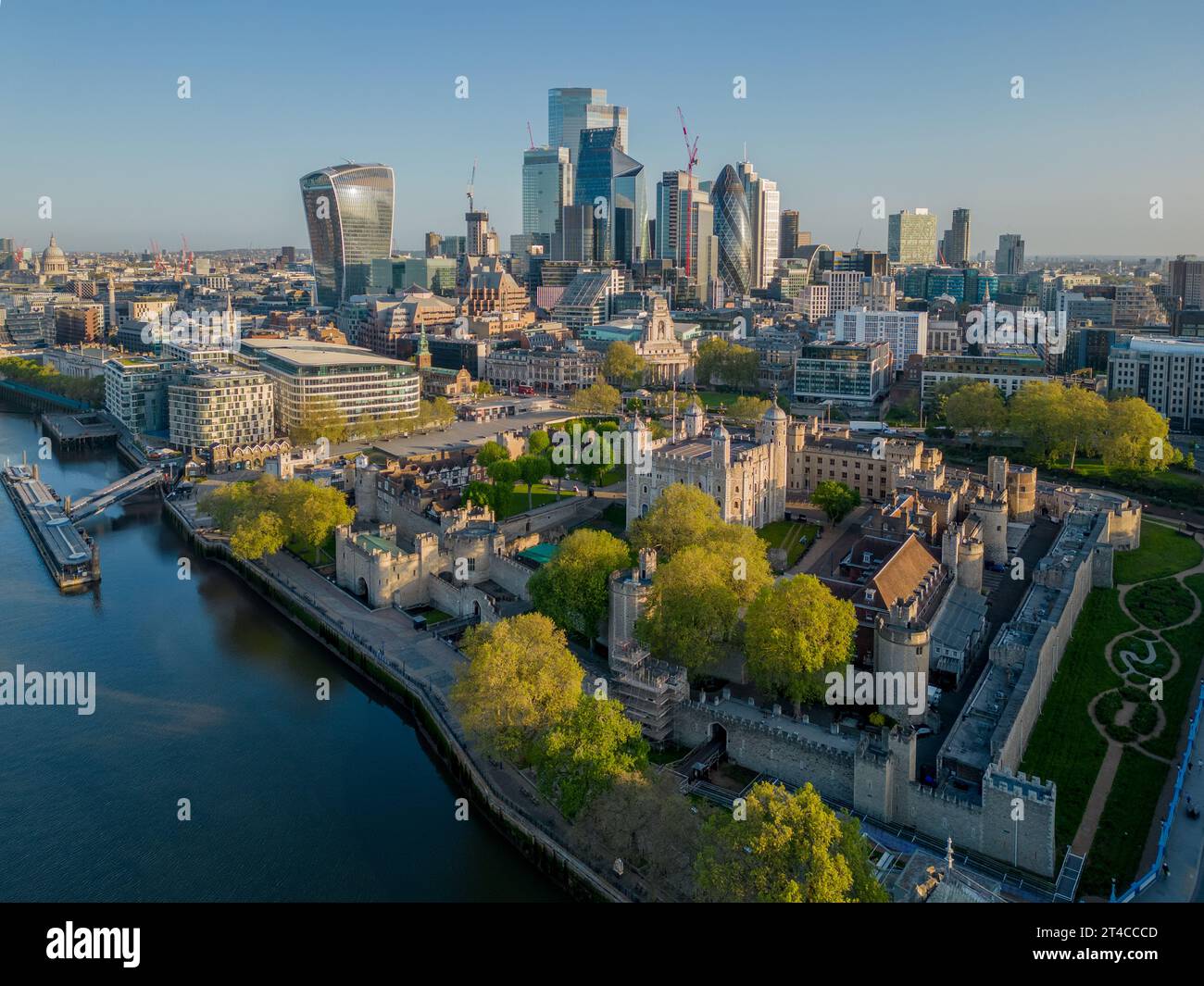 Tower of London aerial view with the modern city behind the historic tourist attraction on the river Thames. City skyline of banking Stock Photo