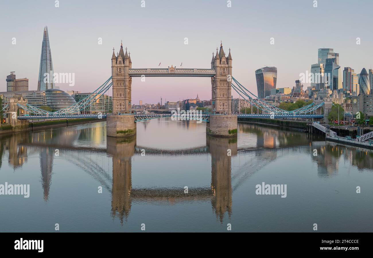 Tower Bridge London reflected in the river thames, aerial view looking down the river thames towards the city and The Shard. Stock Photo