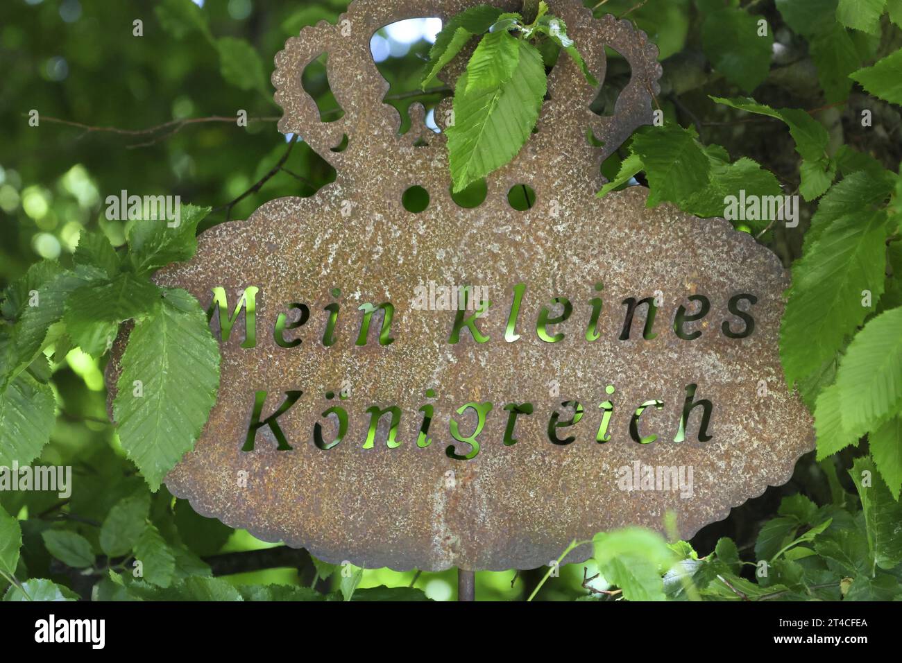 rusty garden sign with the words 'Mein kleines Koenigreich', Germany Stock Photo