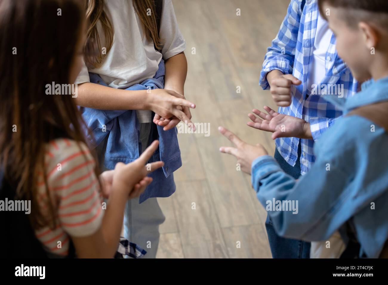 Kids playing finger game at break at school Stock Photo - Alamy
