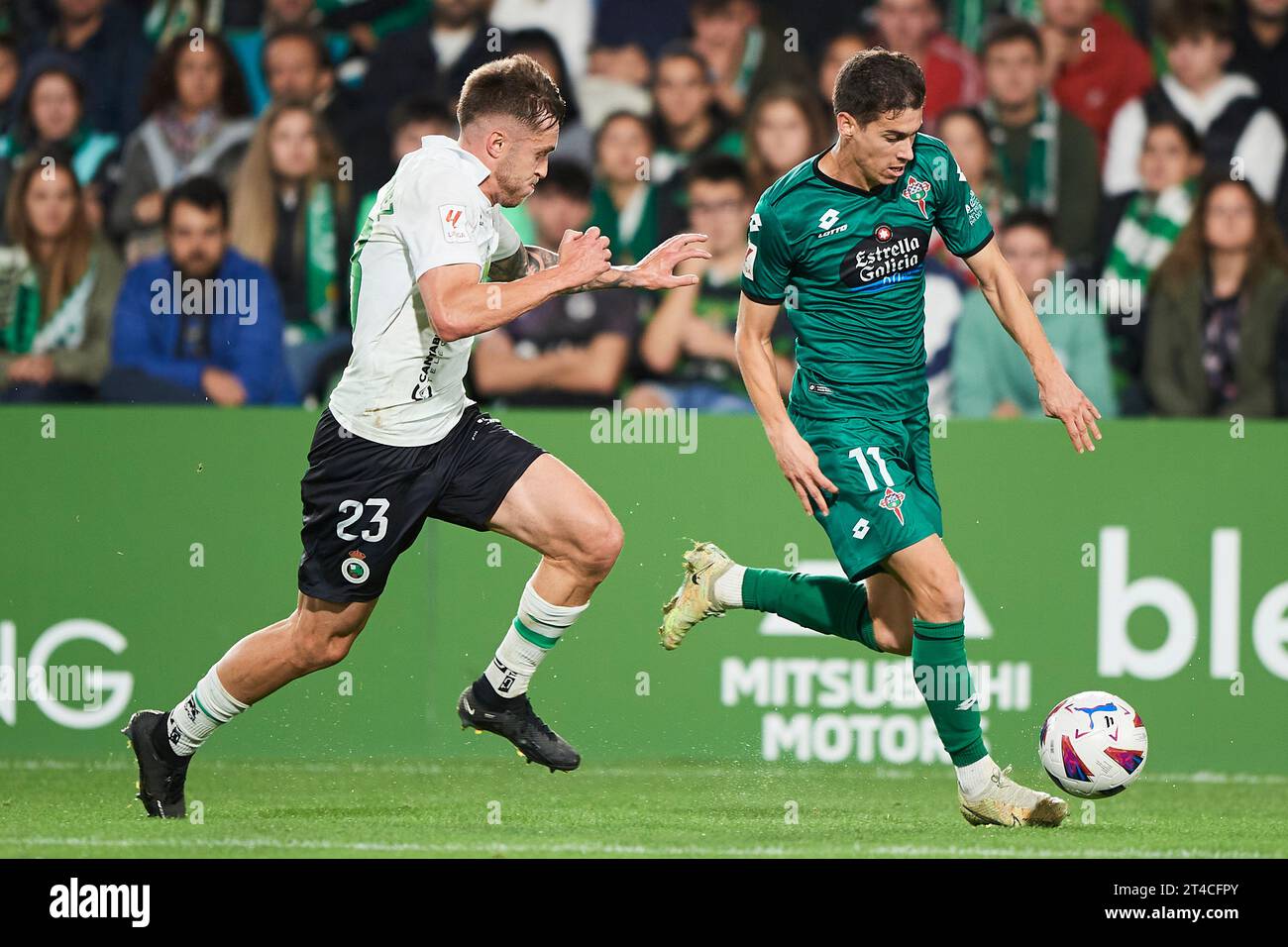 Nacho Sanchez of Racing Club Ferrol duels for the ball with Daniel Fernandez of Real Racing Club during the LaLiga Hypermotion match between Real Raci Stock Photo
