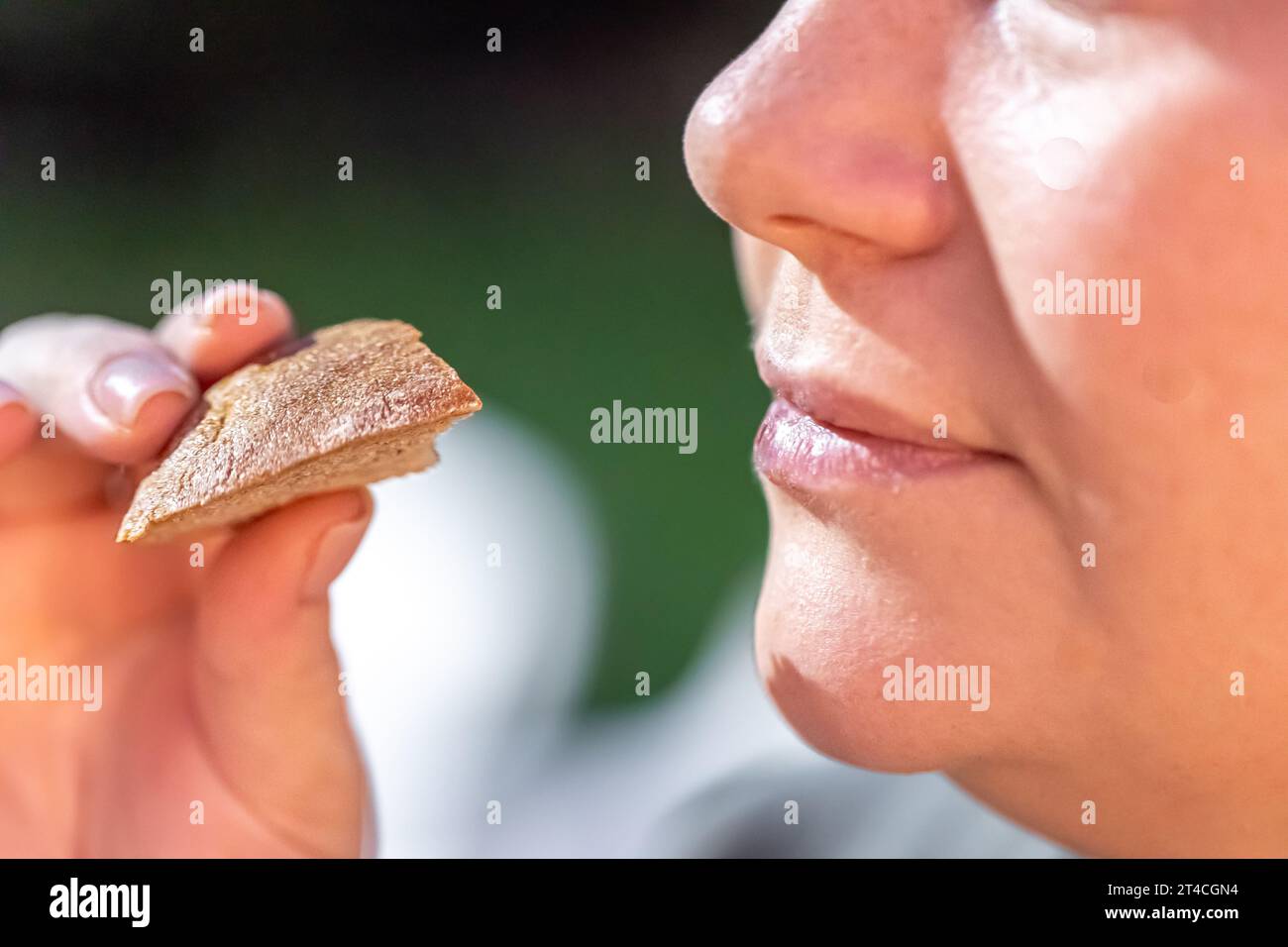 Detailed shot of a man eating bread. Stock Photo