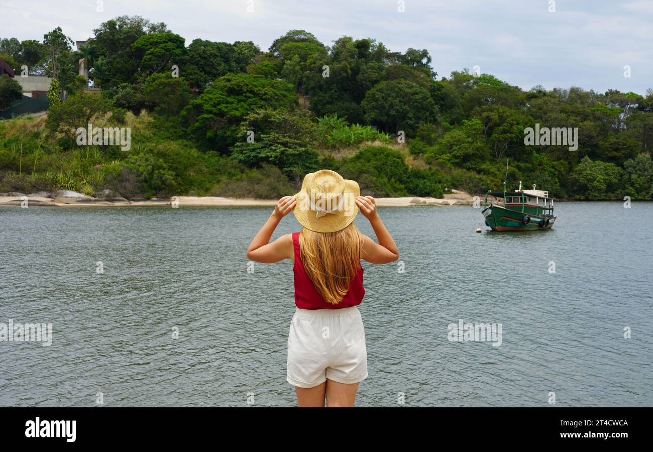 Vacation in South America. Back view of tourist girl in Vitoria, Espirito Santo, Brazil. Stock Photo