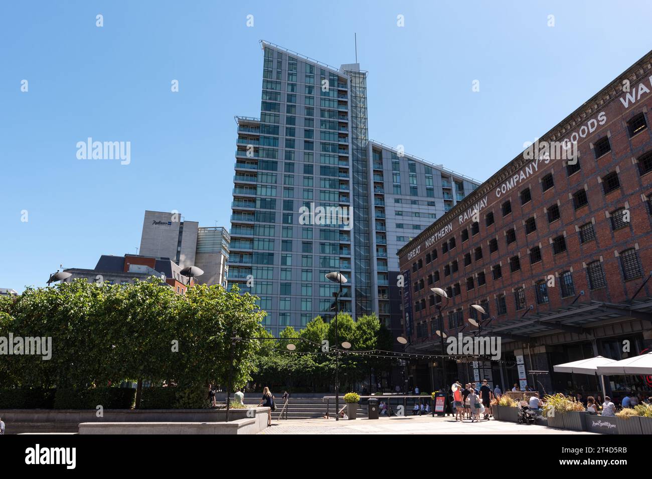 Modern apartment building towers over the Great Northern Warehouse in