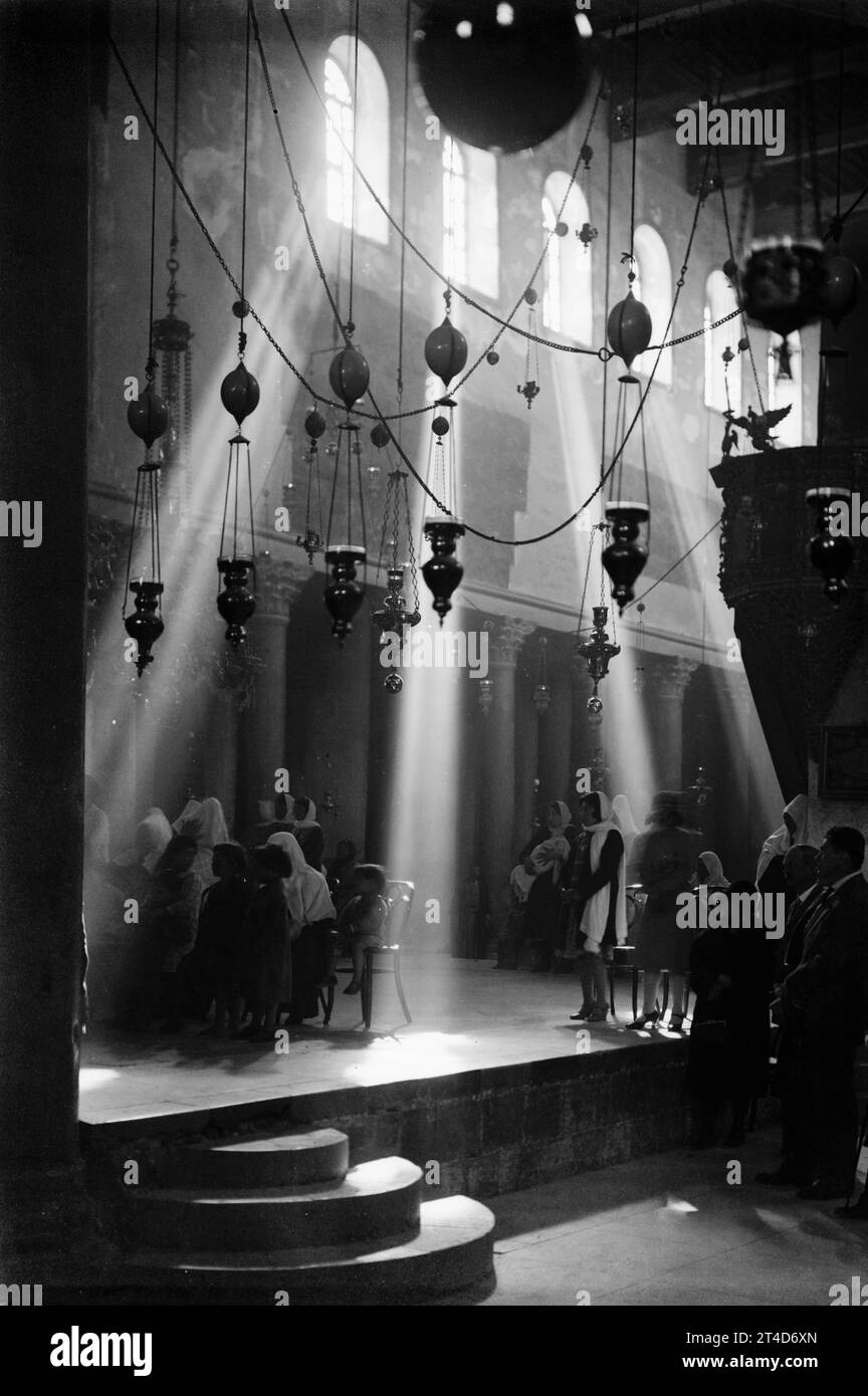 Church of the Nativity, Bethlehem, by American Colony Jerusalem Photo Department, ca. 1936  During Christmas services in Church of the Nativity, Bethlehem, Palestine, by the American Colony Jerusalem Photo Department, between 1934 and 1939. Stock Photo