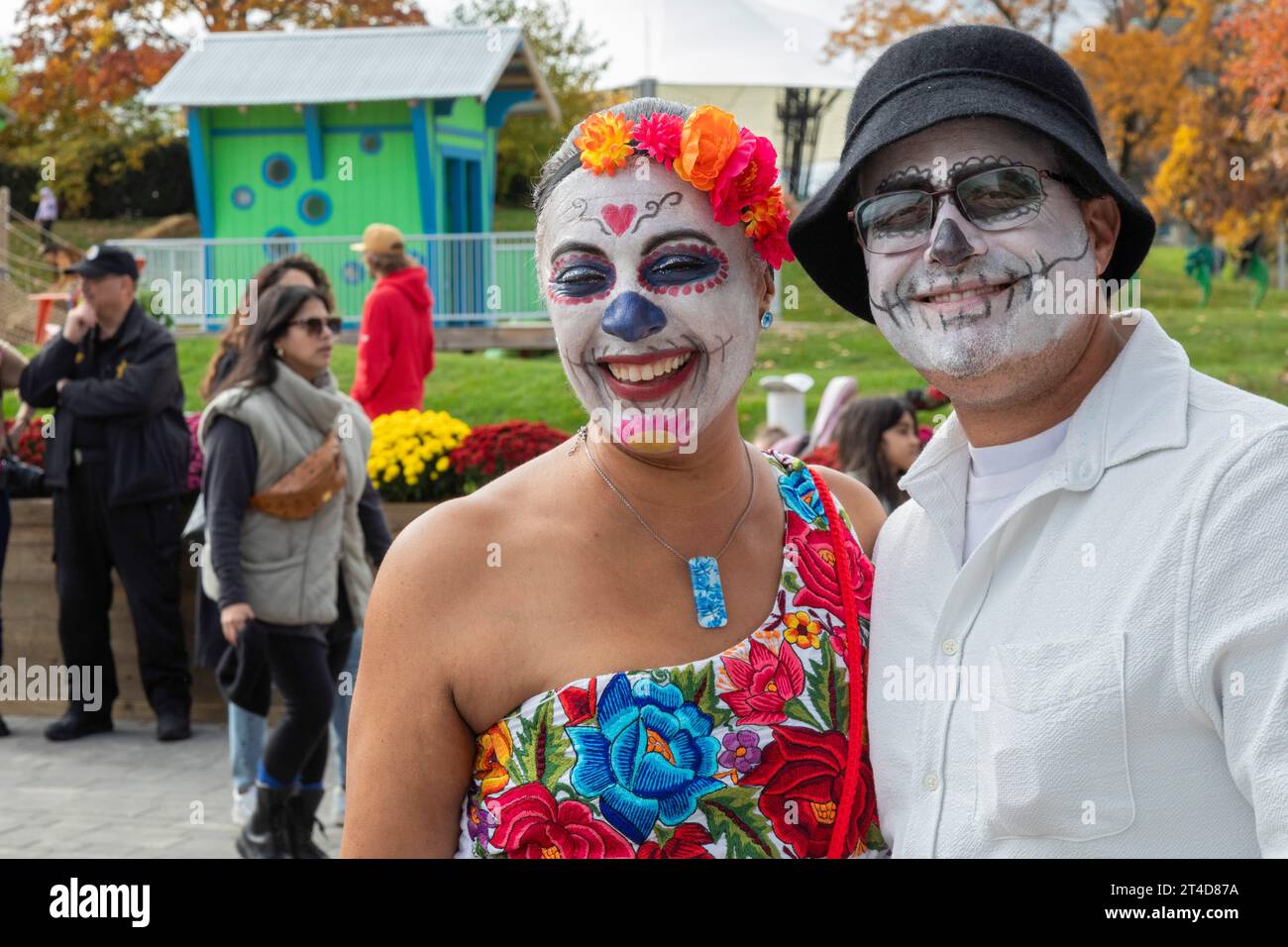 Detroit, Michigan - Day of the Dead celebration at Valade Park on the Detroit Riverfront. Some visitors painted their faces to honor the Mexican tradi Stock Photo
