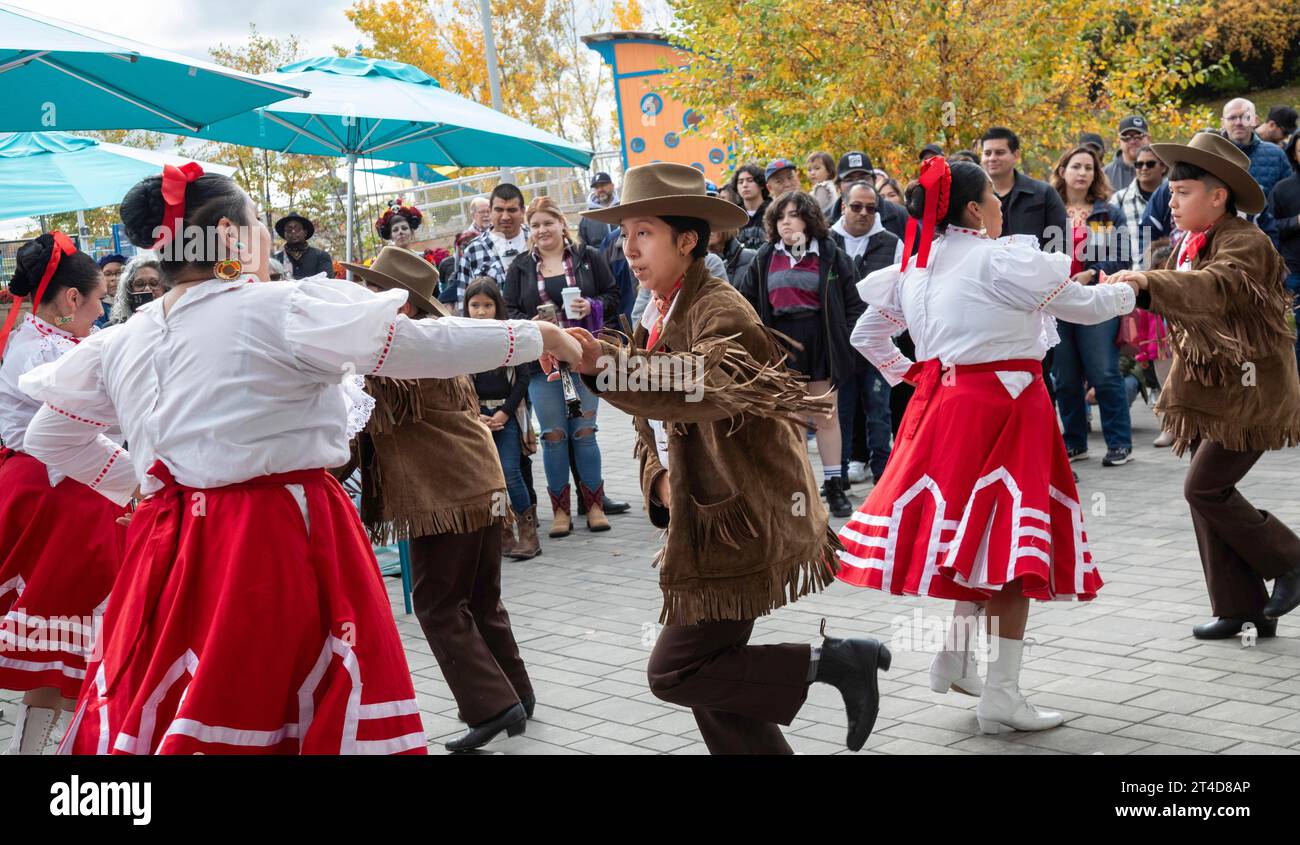 Detroit, Michigan - The Ballet Folklorico Moyocoyani Izel performs during the Day of the Dead celebration at Valade Park on the Detroit Riverfront. Stock Photo