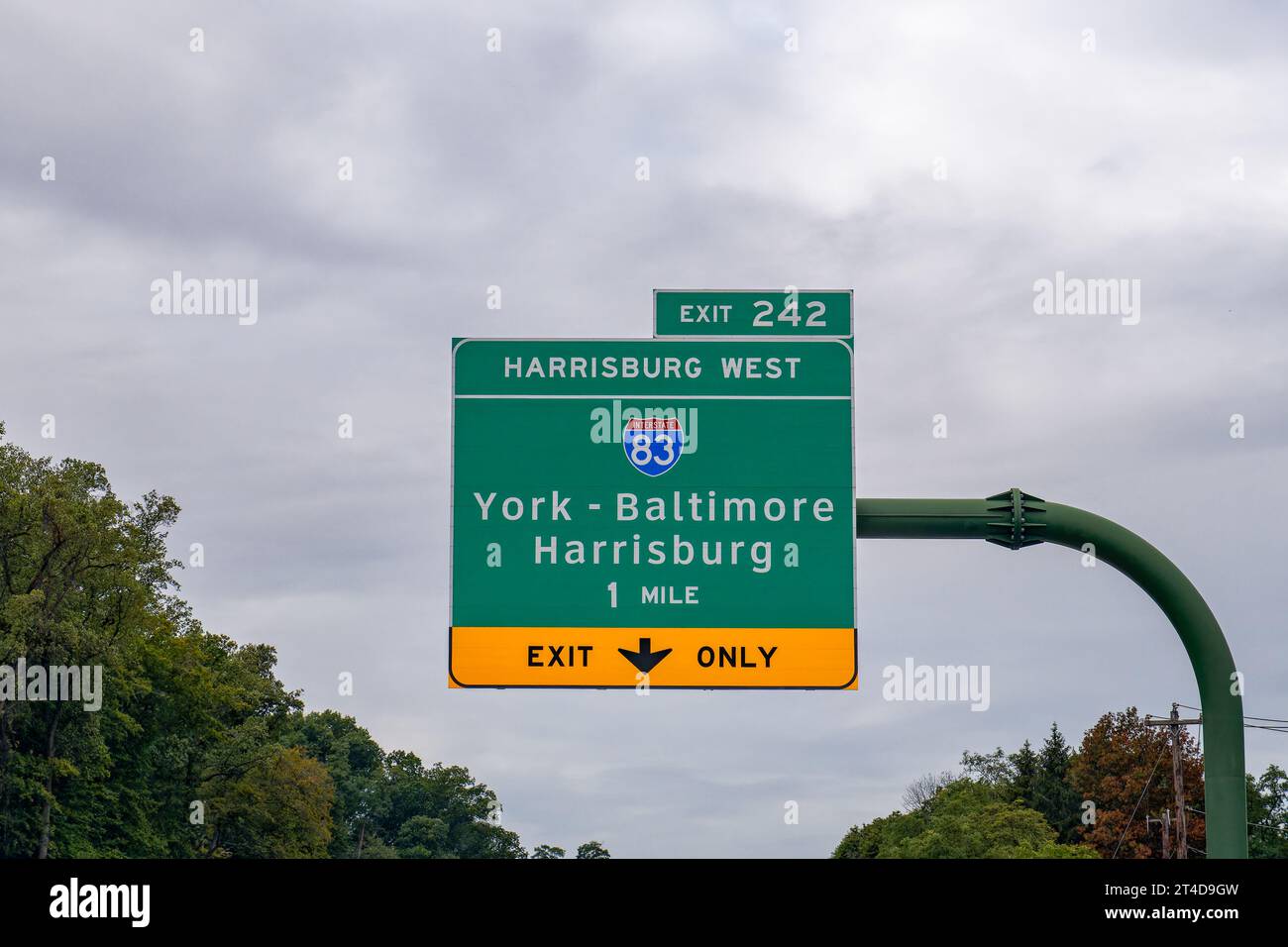 Exit 242 sign on I-76 Pennsylvania Turnpike for Interstate 83 toward York - Baltimore or Harrisburg Stock Photo