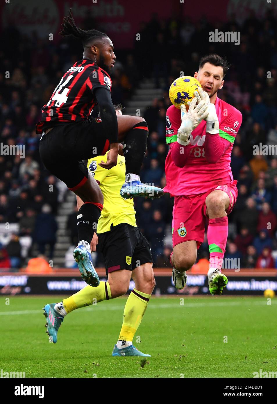 James Trafford of Burnley catches the ball a head of Antoine Semenyo of AFC Bournemouth. AFC