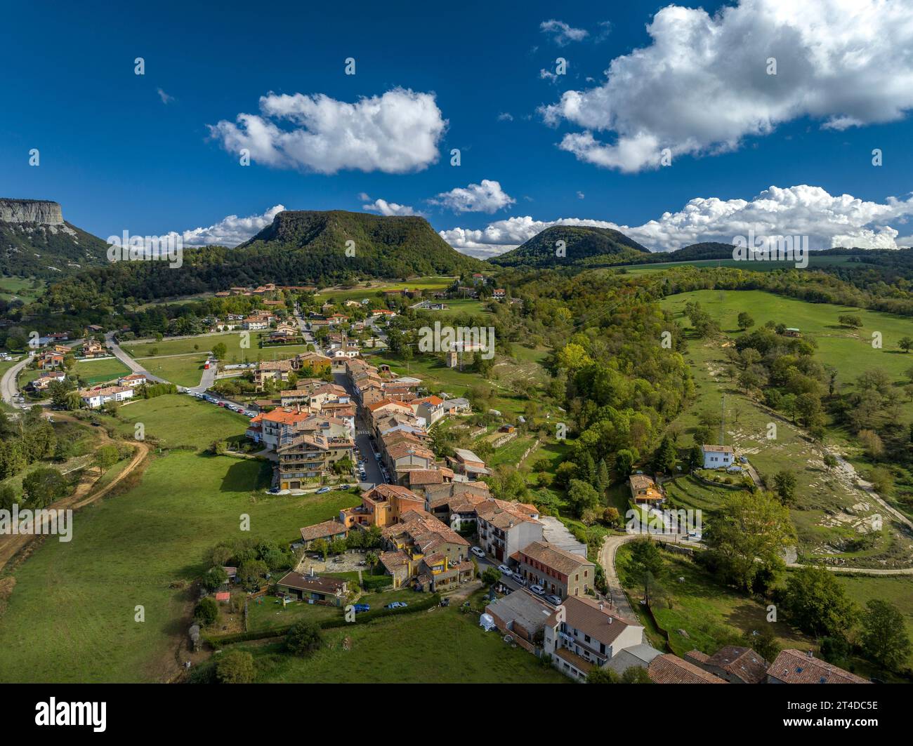Aerial view of the village of Cantonigròs and the surrounding meadows and cliffs of Collsacabra or Cabrerès (Osona, Barcelona, Catalonia, Spain) Stock Photo