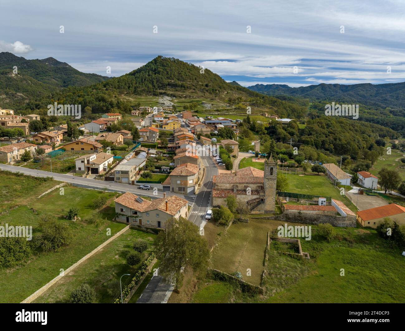 Aerial view of the village of Santa Maria de Besora and the Vidrà valley and Bisaura region on a cloudy day (Osona, Barcelona, Catalonia, Spain) Stock Photo