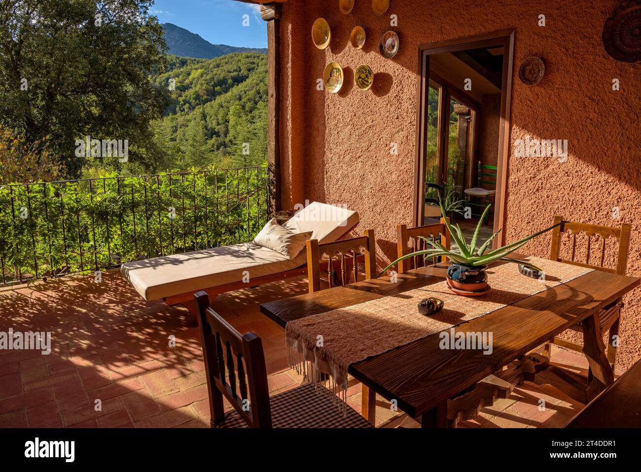 Common terrace of the Can Xisquet rural country house, in Viladrau, with views of Montseny (Osona, Catalonia, Spain) ESP: Terraza común de Can Xisquet Stock Photo