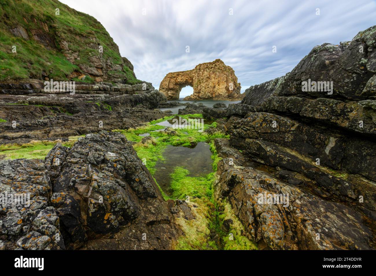 The Pollaird Sea Arch is a 20-meter-high sea arch, carved from the rugged Fanad Peninsula in Donegal, Ireland. Stock Photo