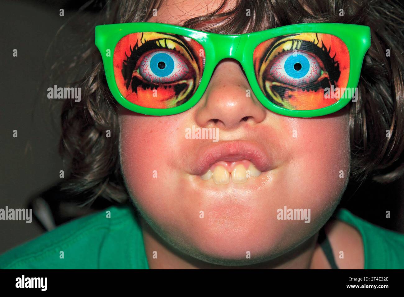 a 10 year old girl with funny glasses on Stock Photo