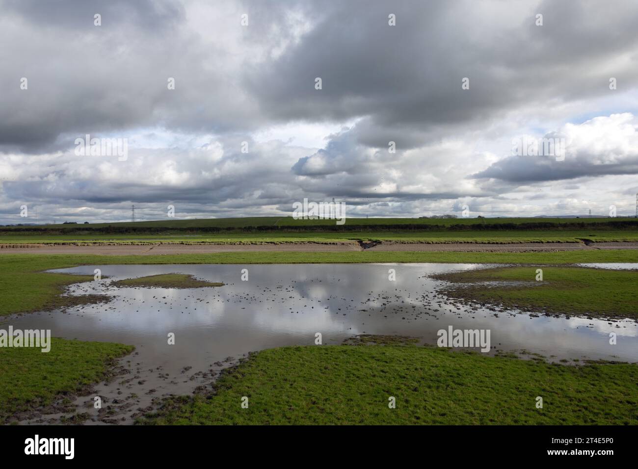 Flooded and waterlogged ground Becconsall Out Marsh looking toward the River Douglas at Hesketh Bank Lancashire England Stock Photo