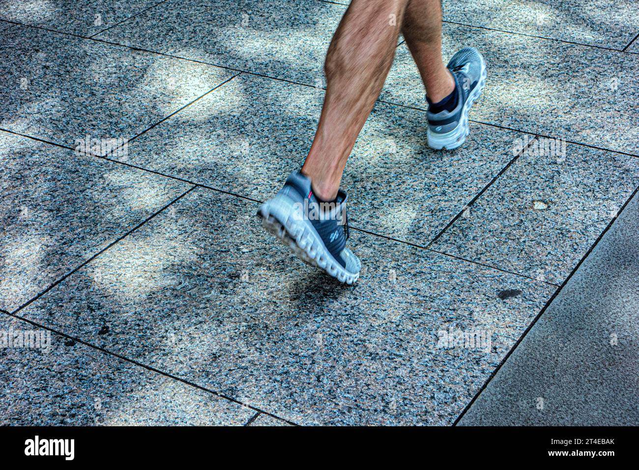 Close-up of feet walking, wearing sneakers or trainers Stock Photo