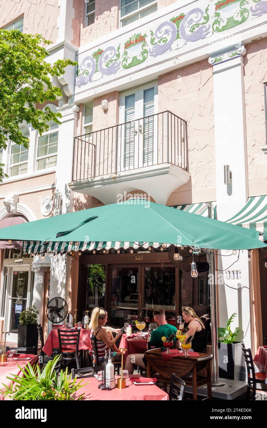 Miami Beach Florida,Espanola Way historic Spanish Village,outside exterior,building front entrance,Espanolita El Carnival,pedestrian walkway,man men m Stock Photo