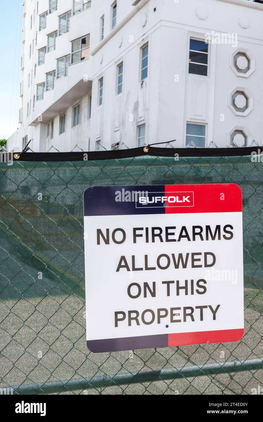 Miami Beach Florida,outside exterior,building front entrance Collins Avenue,no firearms allowed sign Stock Photo