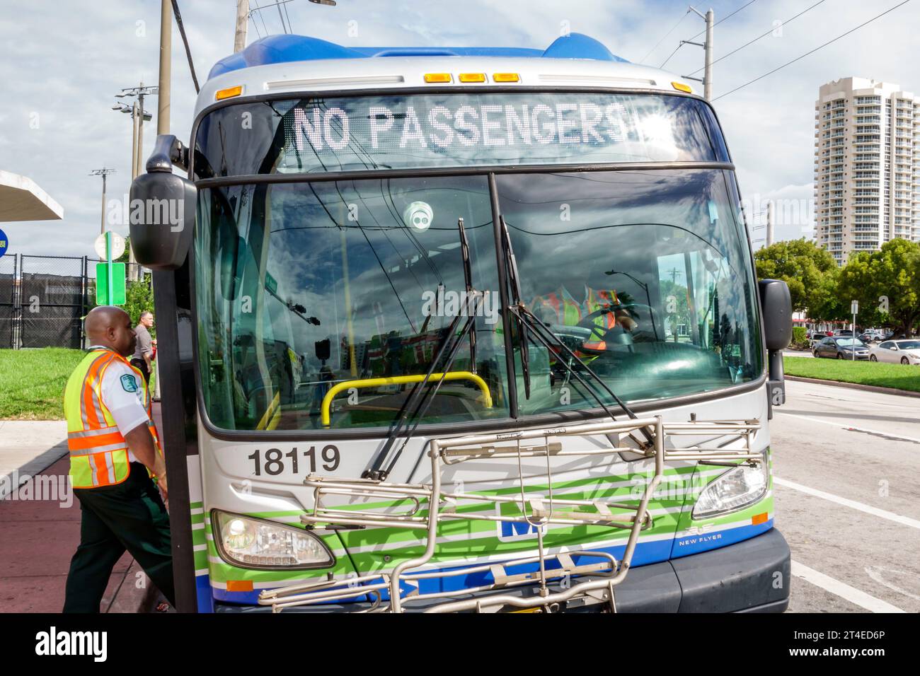 Miami Beach Florida,Collins Avenue,Miami-Dade Metrobus,public bus transportation,no passengers message marquee,man men male,woman women lady female,ad Stock Photo