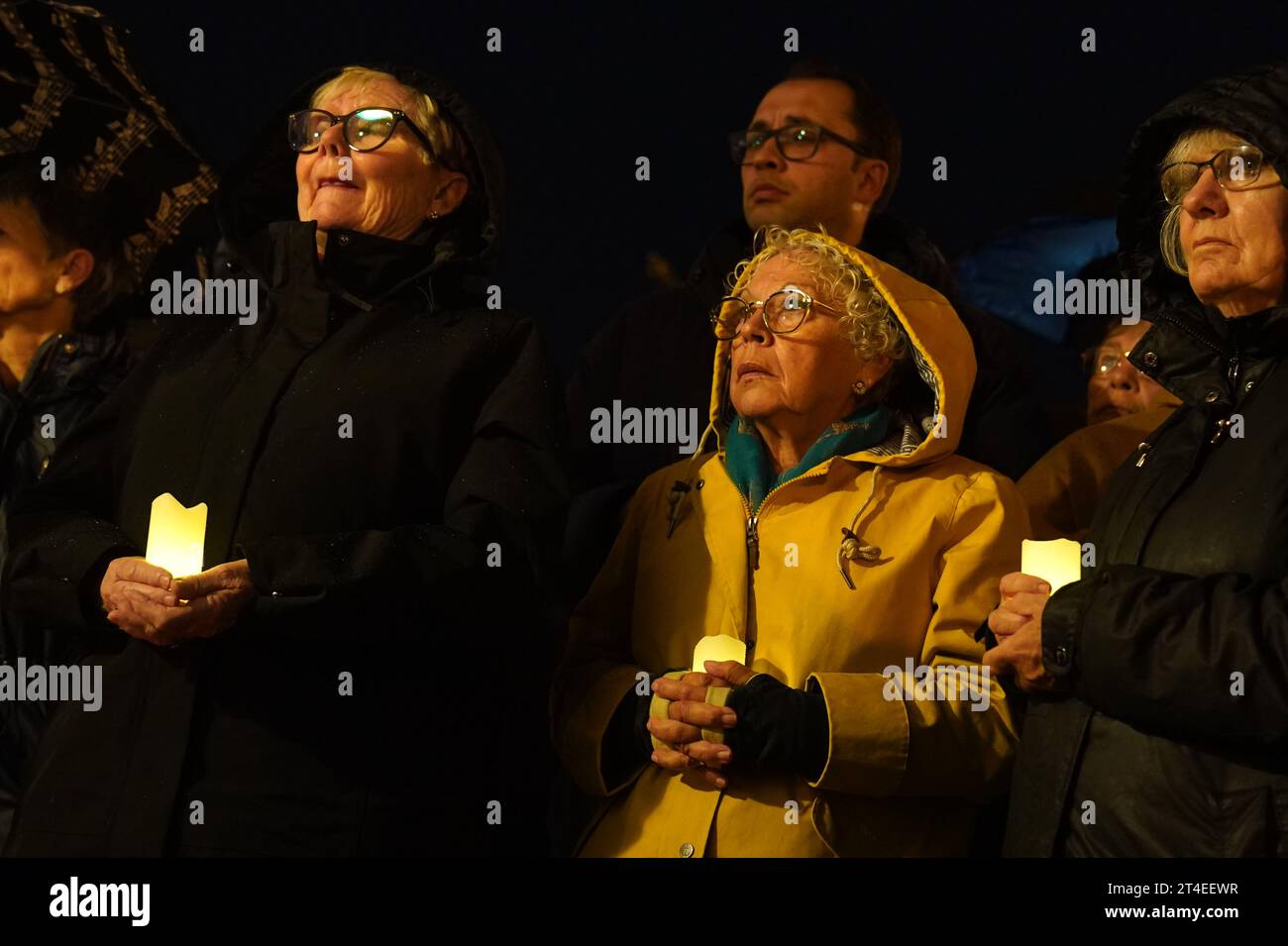 People attend a candlelit Vigil of solidarity for peace in the Middle